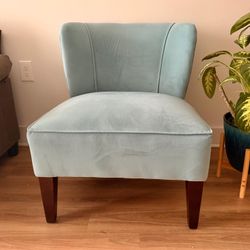 Curved velvet upholstered chair