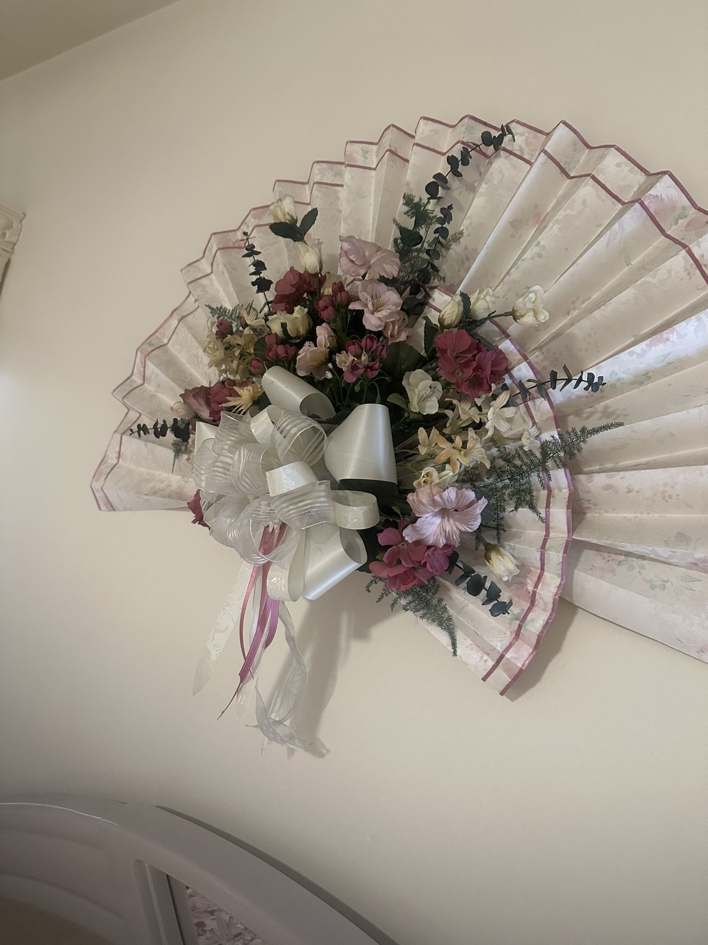 Silk Flowers Arrangement On A Fluted Vinyl Wall Paper