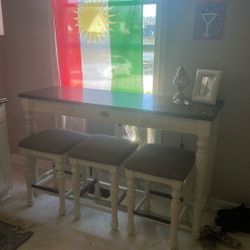 table with three barstools