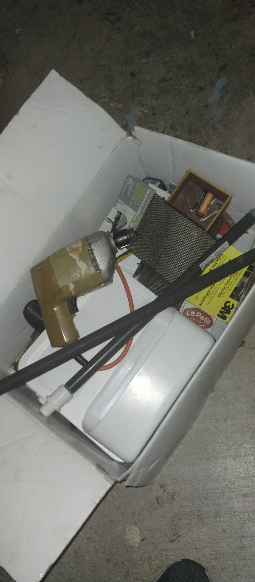 Drill With A Box Of Tools
