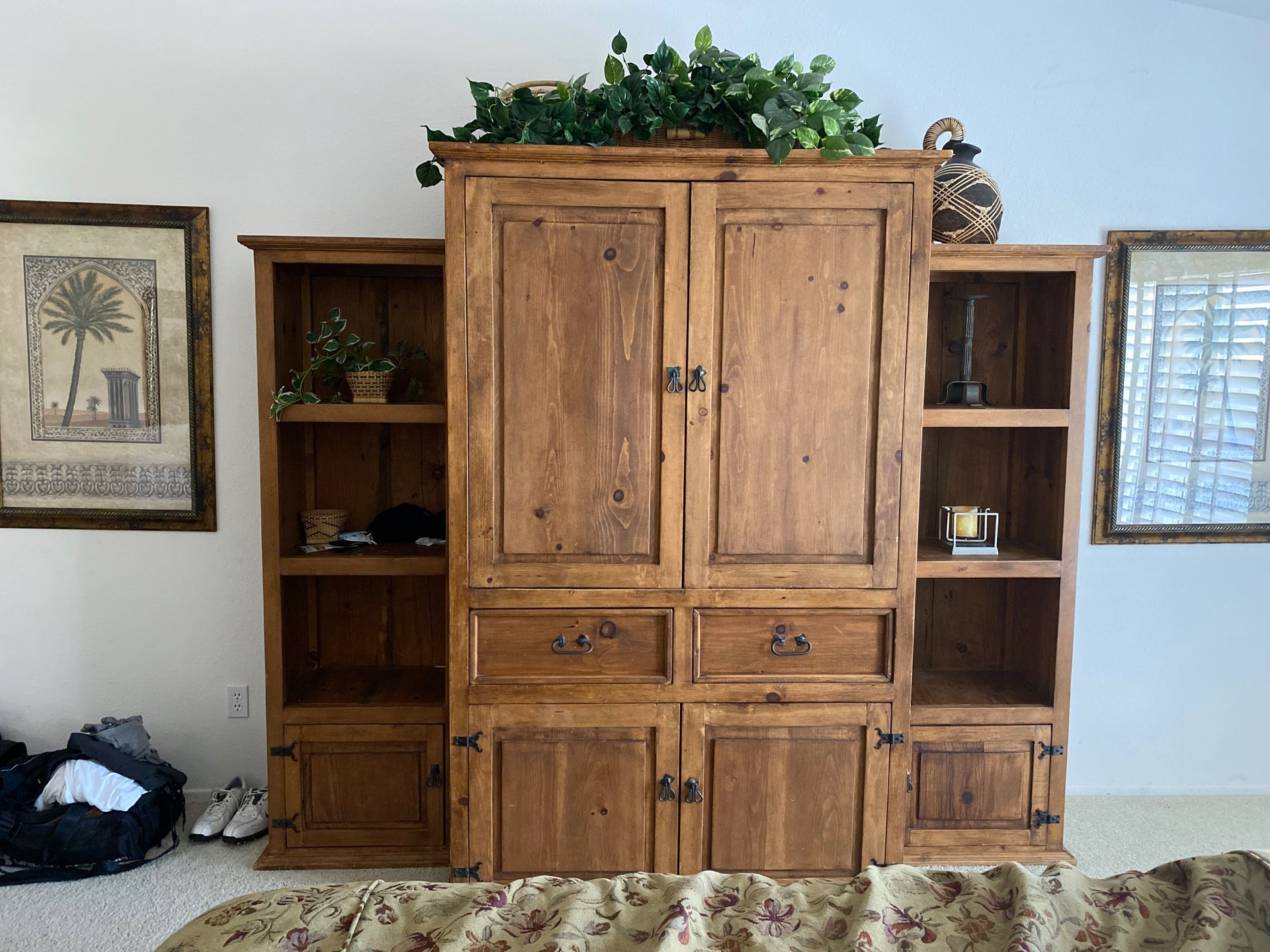 Armoire with side shelving.