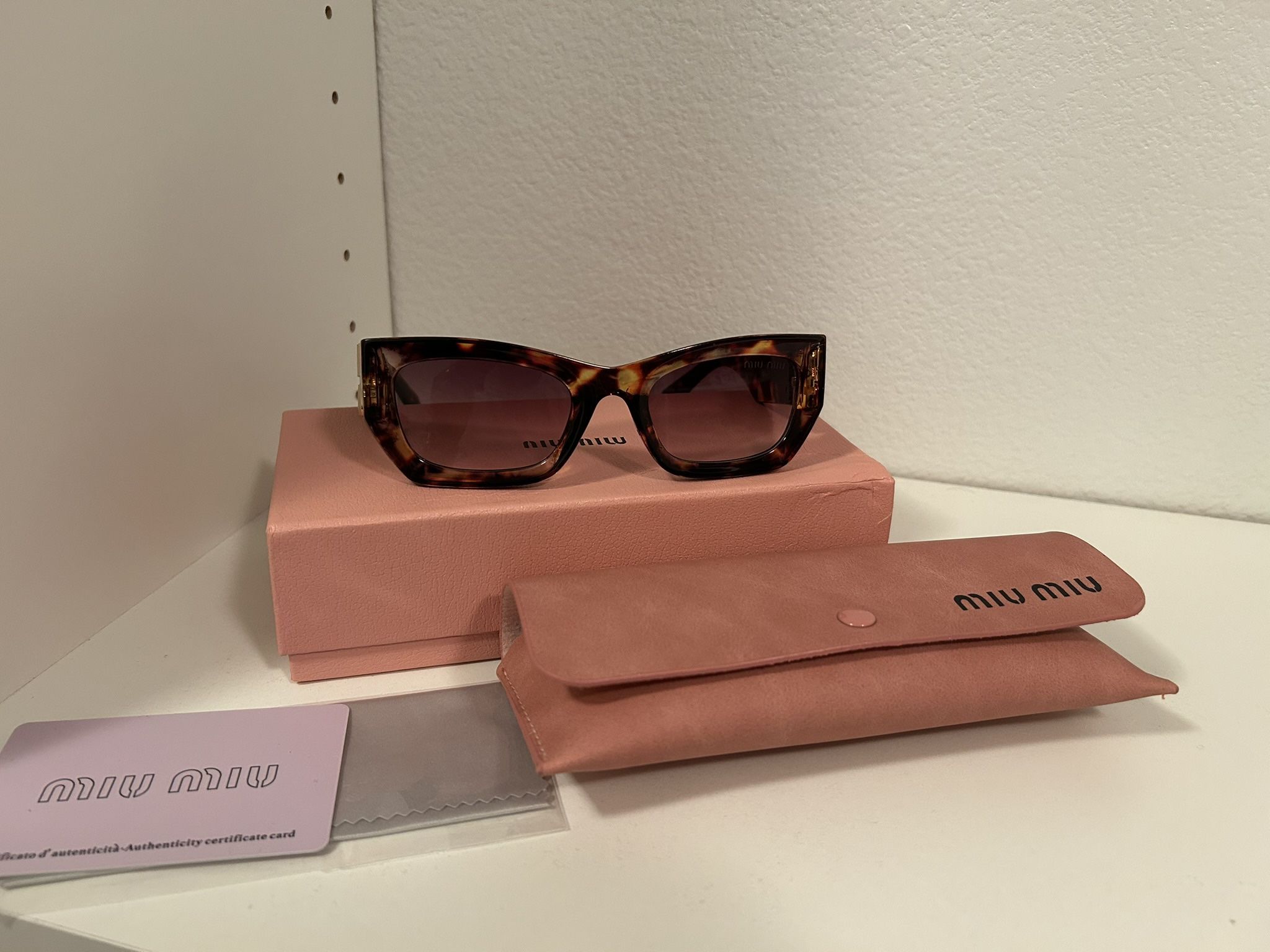 miumiu women’s Sunglasses MU 09WS 
