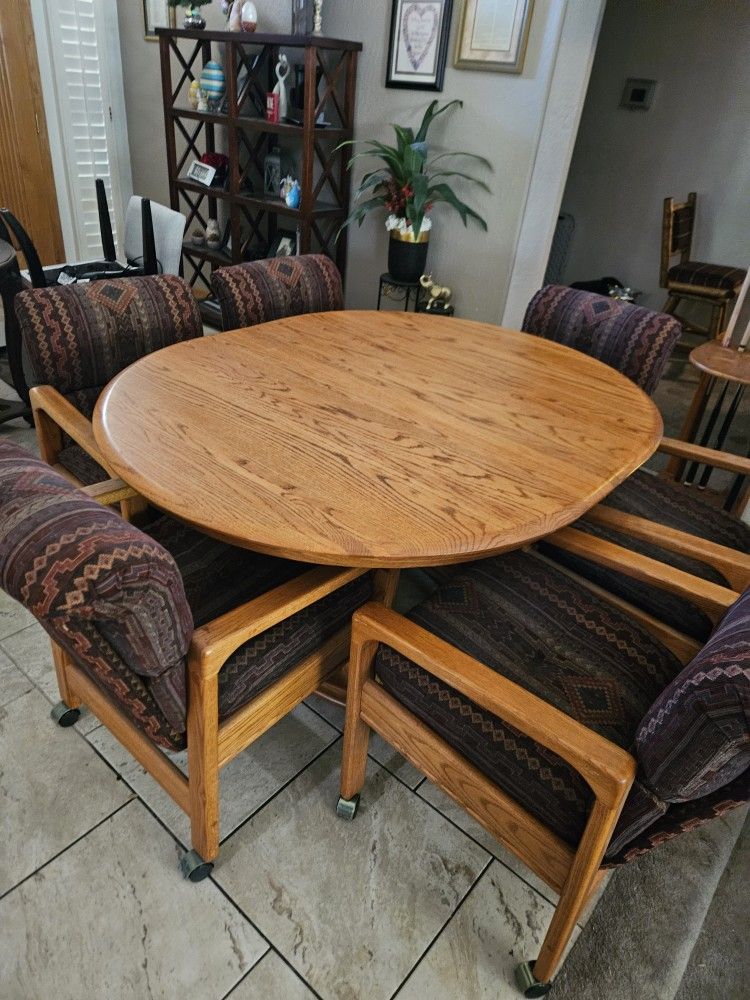 **Price Reduced.... Oak Table and Six Chairs On Casters