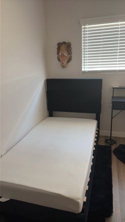 Twin bed with mattress and desk