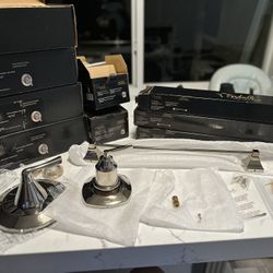 5 Shower Trim Sets And Three Towel Bars 