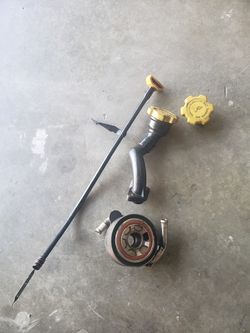 Subaru oil cooler, dip stick, oil cap