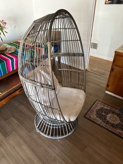 Swivel wicker egg chair