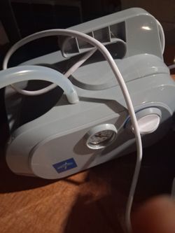 Medline Vacu-Line Suction Aspirator (Model HCS7001), a compact device used for home care and clinical settings to remove respiratory