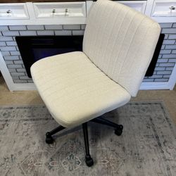 beige criss cross sitting office chair 