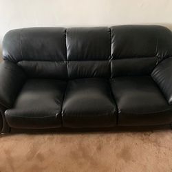 2 Piece Couch Barely used. The color is black. 