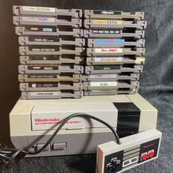 Nintendo nes console w/ all hook ups, controller, and 20 games