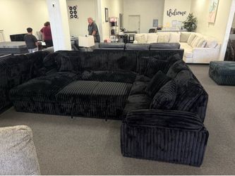 Black corduroy sleeper sofa sectional with storage chaise