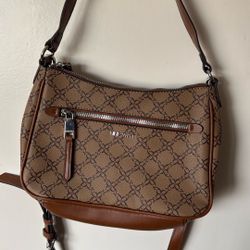 The Nine West Collette Mini shoulder bag features a monogram pattern with tan and brown accents