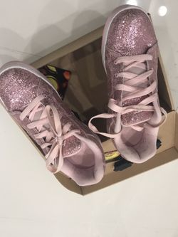 Heelys Women size 9 hardly used like new Can be used as regular shoes too