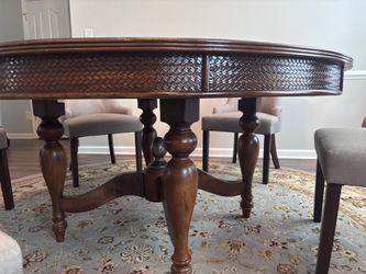 Solid wood round dining room table with six chairs