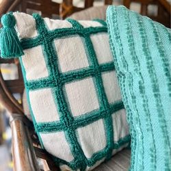Three green couch pillows