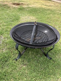 Fire Pit With Spark Screen And Dry Firewood