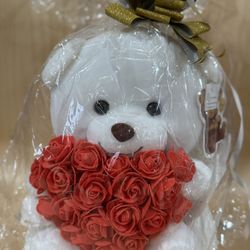 White teddy bear with foam flower heart