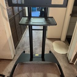 Rolling TV stand with 48 inch TCL SMART TV.