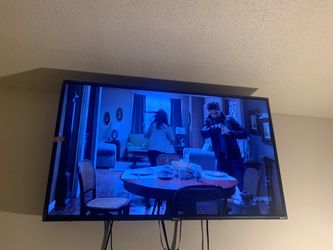 Hisense 40-inch TV, includes remote control.