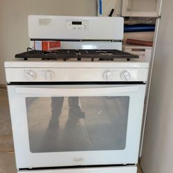White Whirlpool gas range.
