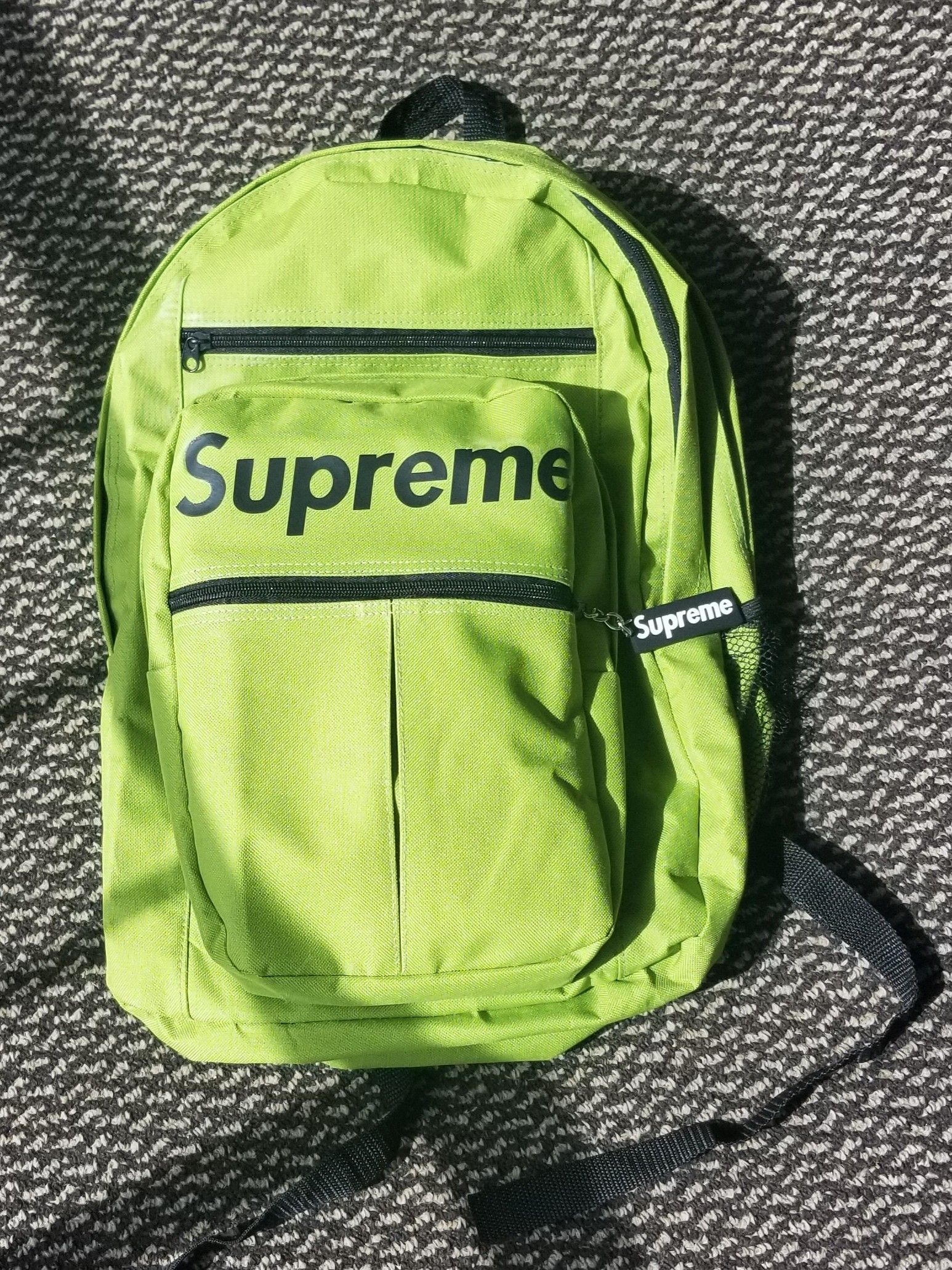 Lime-green backpack; standard-sized