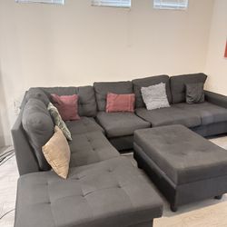 Large Black Sectional with Matching Storage Ottoman
