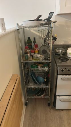 bunch of kitchen stuffs and shelf