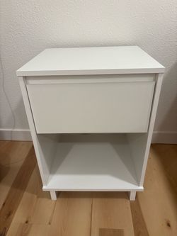 Two white bedside tables
