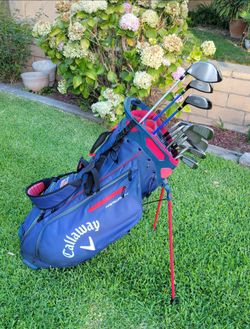 Golf set with king cobra irons and driver. Taylormade sand wedge. CALLAWAY bag. Plys
