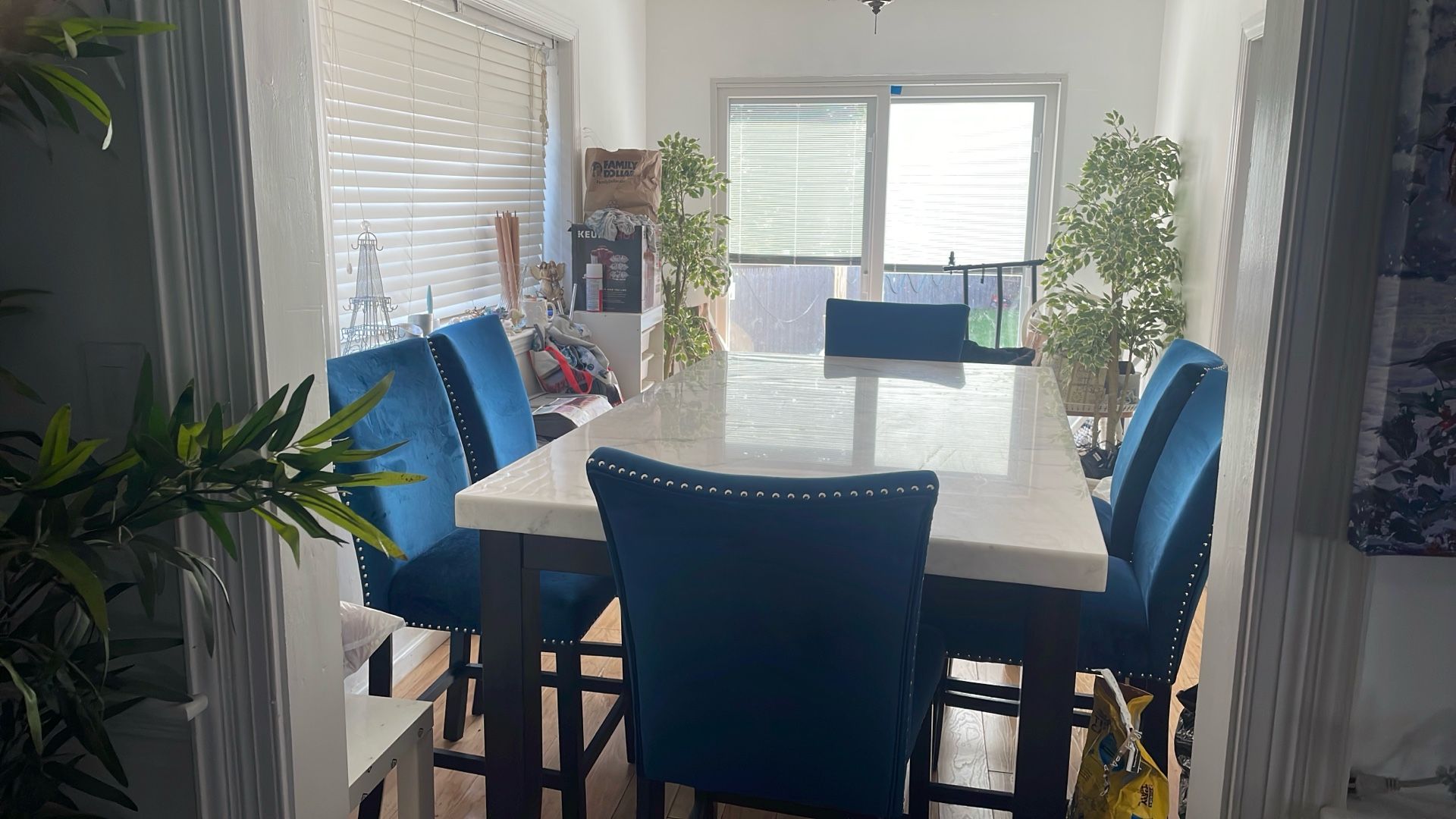 marble table with 6 blue chairs