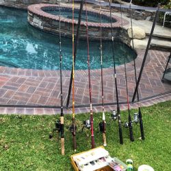 SEVEN (7) Fishing Rods with Reels Plus a Tackle Box with Line,Sinkers & Lures.