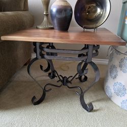 End table with one of a kind wood top made with local trees. Black iron base