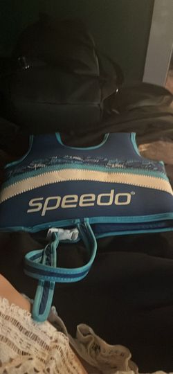 adult life jacket to sqaure theow life devices and two small children lige jackets