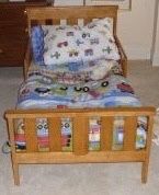 Solid wood toddler bed frame - includes bedding set with truck pattern!