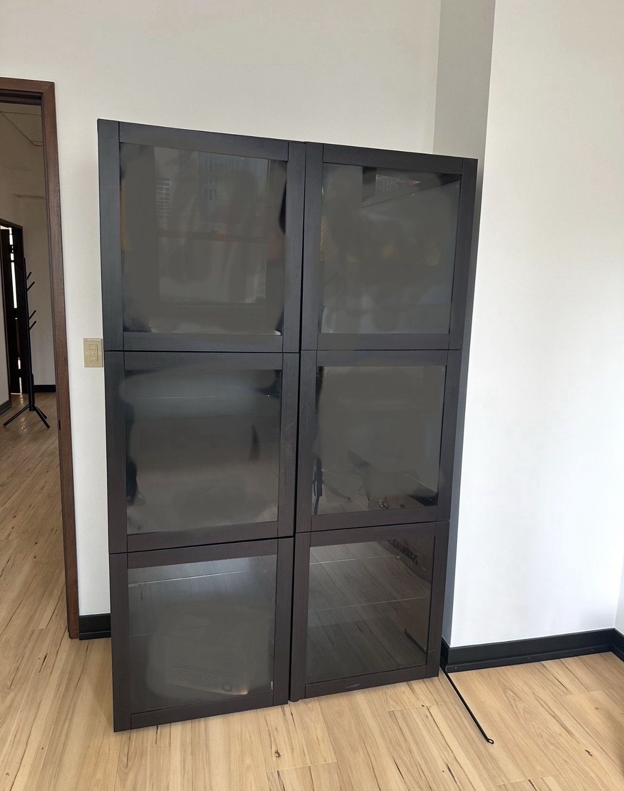 2 IKEA Black Shelves  with Glass Doors and Glass shelves. 