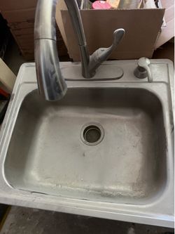Used stainless Steele sink with faucet
