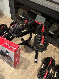 Bowflex dumbbells & stand. View the comment below