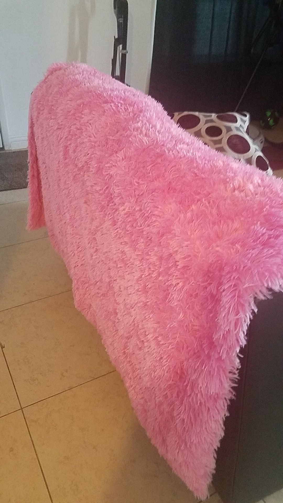 Pink fuzzy throw blanket