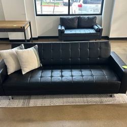 86.61'' Black Leather Biscuit Convertible Sofa - Like New