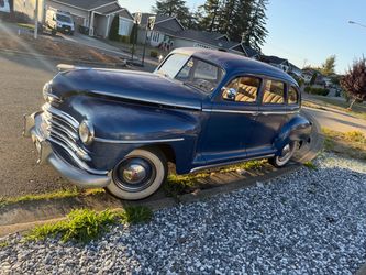 Vintage Plymouth De Luxe 4-Door Sedan