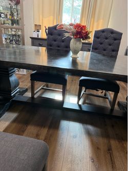 Large gray dinner table with 6 chairs