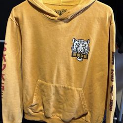 Stained. Brand: fresh laundry. Men’s size large. Yellow white tiger hoodie.
