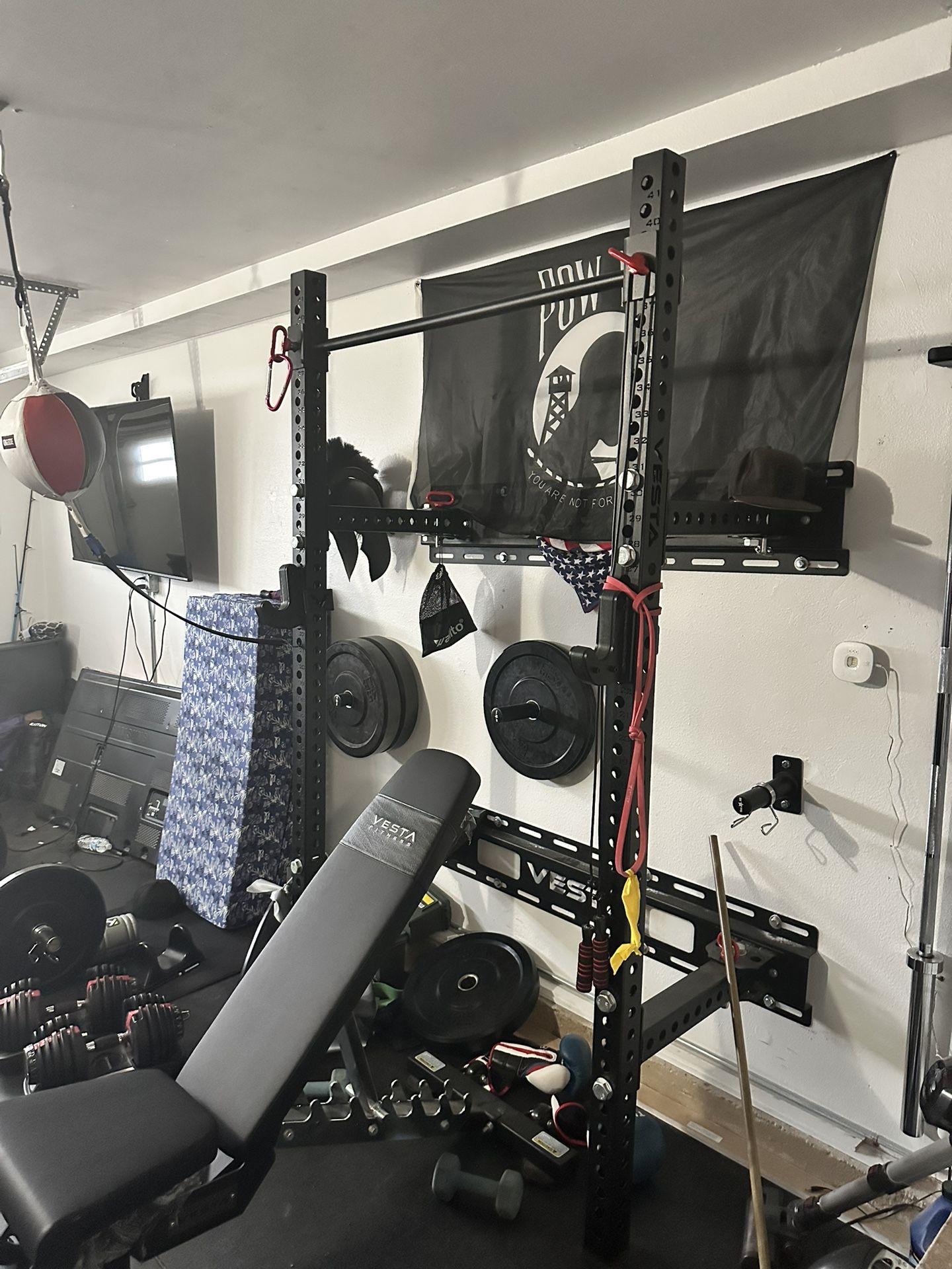 Must Sell OBO- Squat Rack, Curling Bar, Heavy Duty Mats, Olympic Barbel, Rubber Plates, And Adjustable Dumbbell, Uppercut Bag And Double Bag.