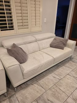 White Leather Natuzzi Set. 1 loveseat and 2 Sofa