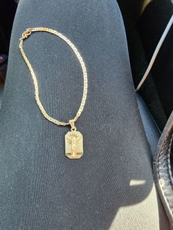 14k gold bracelet and pendant for $900.