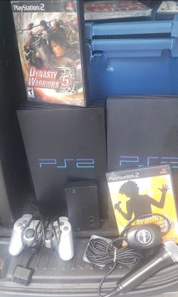 PlayStation 2 with karaoke revolution game and microphone