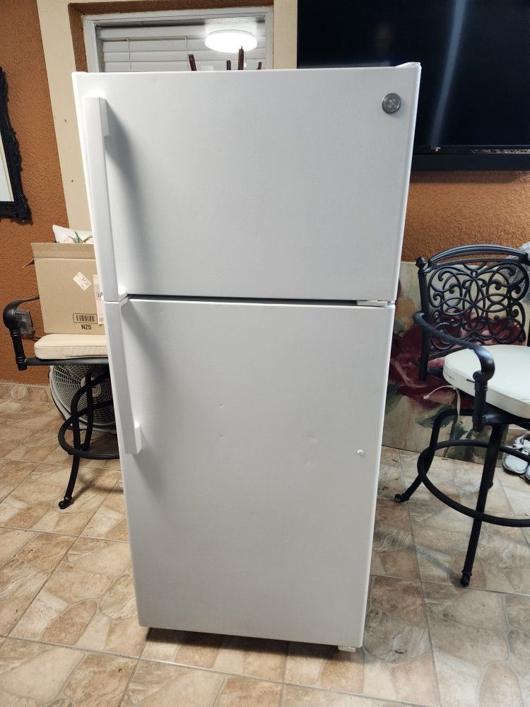 White GE Refrigerator 64,"height and 28 " wide