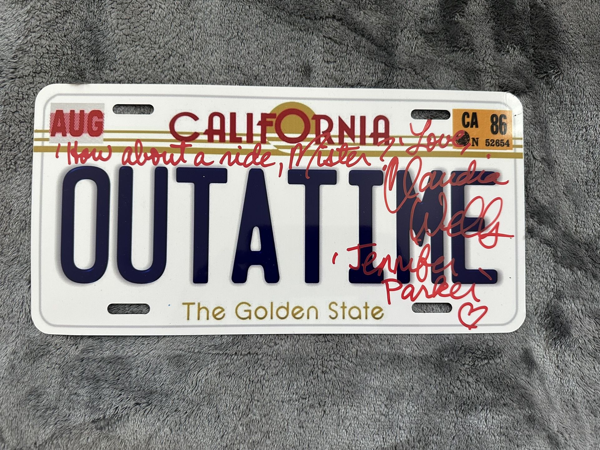 BACK TO THE FUTURE AUTOGRAPHED LICENSE PLATE BY CLAUDIA WELLS