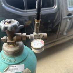 HELiUM Compressed Tank halfway Full With The Gauge And The Valve